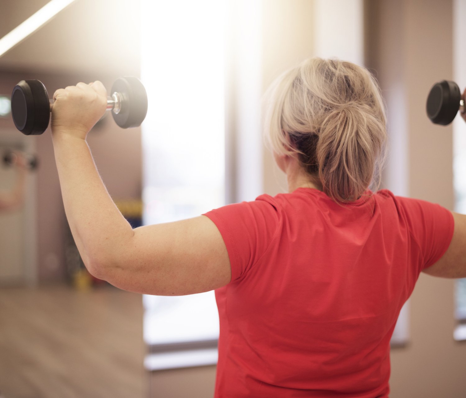 Woman lifting weights.