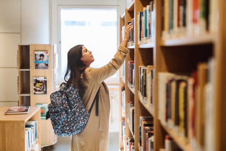 Student choosing books