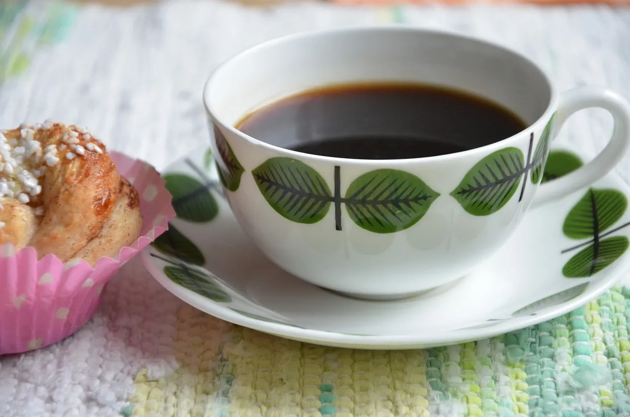 JF fika möte bilden visar en kaffekoppp