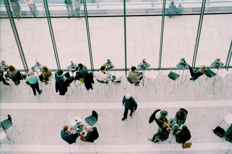 People working in glas building