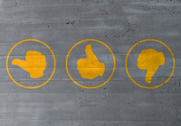 Illustration of three thumbs in yellow, one up, one down and one in the middle.