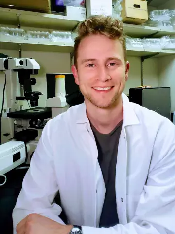 Photo of man with lab coat.